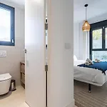 Апартаменты Coastal Retreat With Shared Pool,